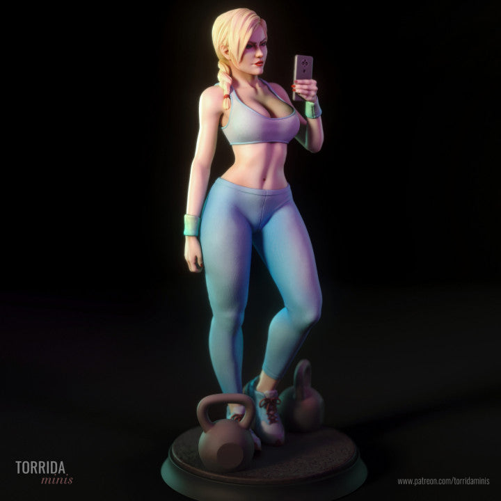 Statue of a woman in athletic wear with kettlebells on a dark background.
