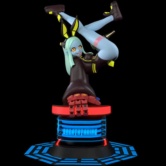 Stylised resin figure posed upside down with legs raised and crossed, wearing a black hoodie and cyberpunk boots. Blue skin, mint green hair, and yellow highlights create strong contrast. Set on a glowing futuristic base labelled “Breathtaking.”
