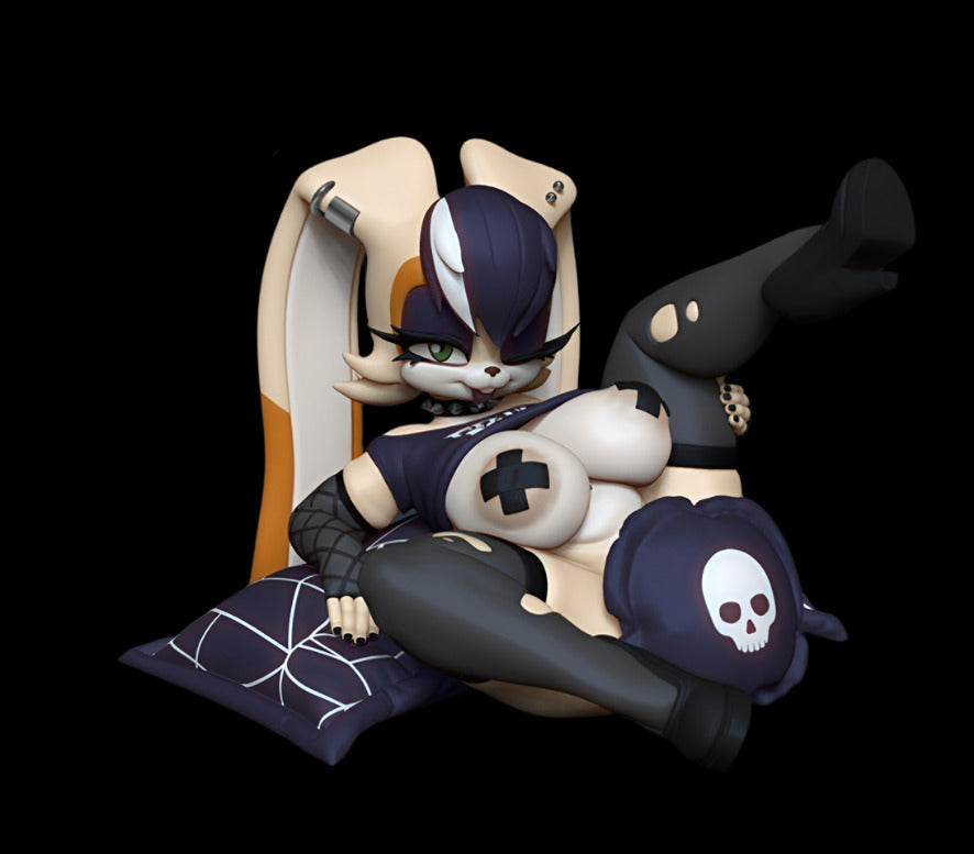 Alternative colourway of reclining anthro bunny resin figure posed on spiderweb pillow and skull cushion. Gothic punk theme with torn leggings, nipple covers, and side-shave hairstyle.